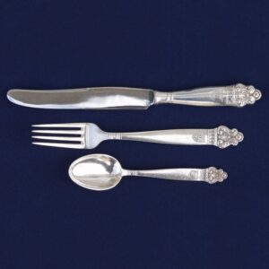 Flatware with an acanthus- like detail at the tip of each handle - Norwegian Metalworking