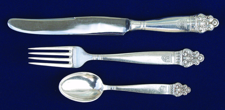 Flatware with an acanthus- like detail at the tip of each handle - Norwegian Metalworking