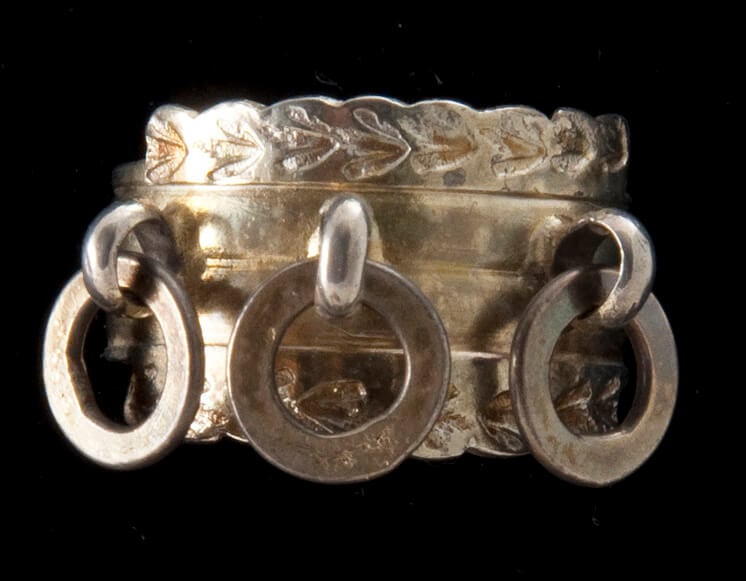 Ring with two convex bands that are bordered by fine floral design - Norwegian Metalworking