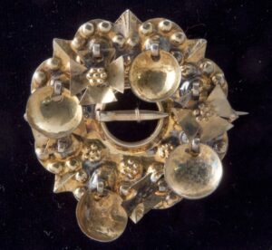 Brooch with bowl-shaped dangles alternating with Greek crosses - Norwegian Metalworking