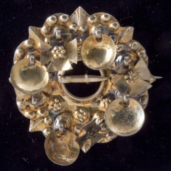 Brooch with bowl-shaped dangles alternating with Greek crosses - Norwegian Metalworking