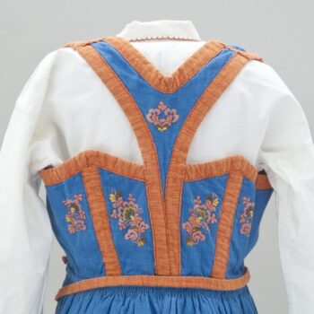Dress with blue vest, a v-back, and orange trim - Textiles
