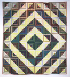 Log Cabin quilt made in the Barn Raising configuration - Textiles