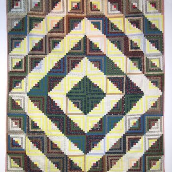 Log Cabin quilt made in the Barn Raising configuration - Textiles