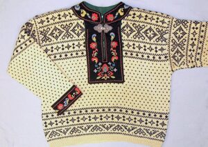 knit pullover sweater has the lice pattern and other traditional geometric Norwegian patterns in bands across the shoulders and waist - Textiles