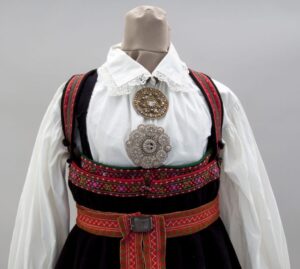 Dress with gathered and flared homespun wool skirt with three black bands at the bottom - Textiles