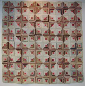 Log Cabin quilt was arranged using alternating light and dark diamonds