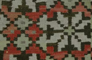 Coverlet with zigzags, crosses, and lightning borders are at the top and bottom - Textiles