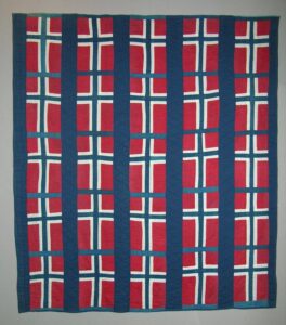 This quilt is made of repeating blocks of Norwegian flags