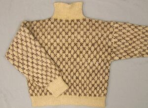 Man's handknit sweater with all-over diamond designs. Short turtleneck - Textiles