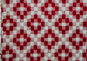 Coverlet woven using crackle weave or halvdreiel technique. Crisscross pattern in red wool - Textiles