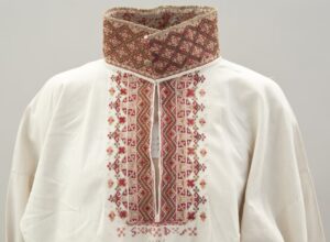 Blouse with three-inch tall standing collar that is covered with fine and dense cross-stitch - Textiles