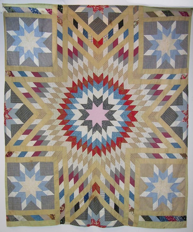 Pieced quilt top is done in the blazing star - Textiles