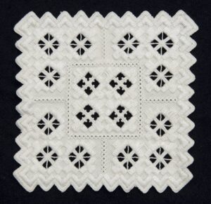 Coasters embroidered in varying traditional Hardanger patterns - Textiles