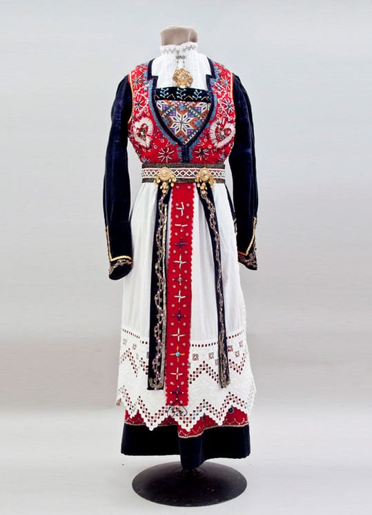Dress with decorated with gold metallic lace and extensive bead work in blue, black, clear, and gold beads - Textiles