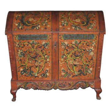 Trunk has dovetailed corner construction with iron reinforcements at the corners and diamond shape escutcheon - Rosemaling