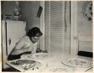 possibly Louise Lysne rosemaling a plate