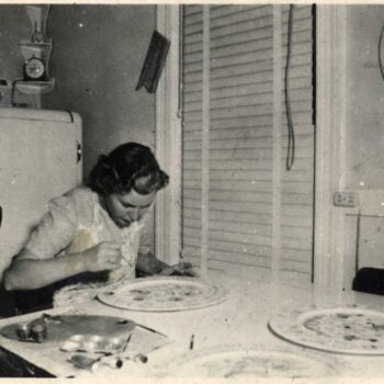 possibly Louise Lysne rosemaling a plate