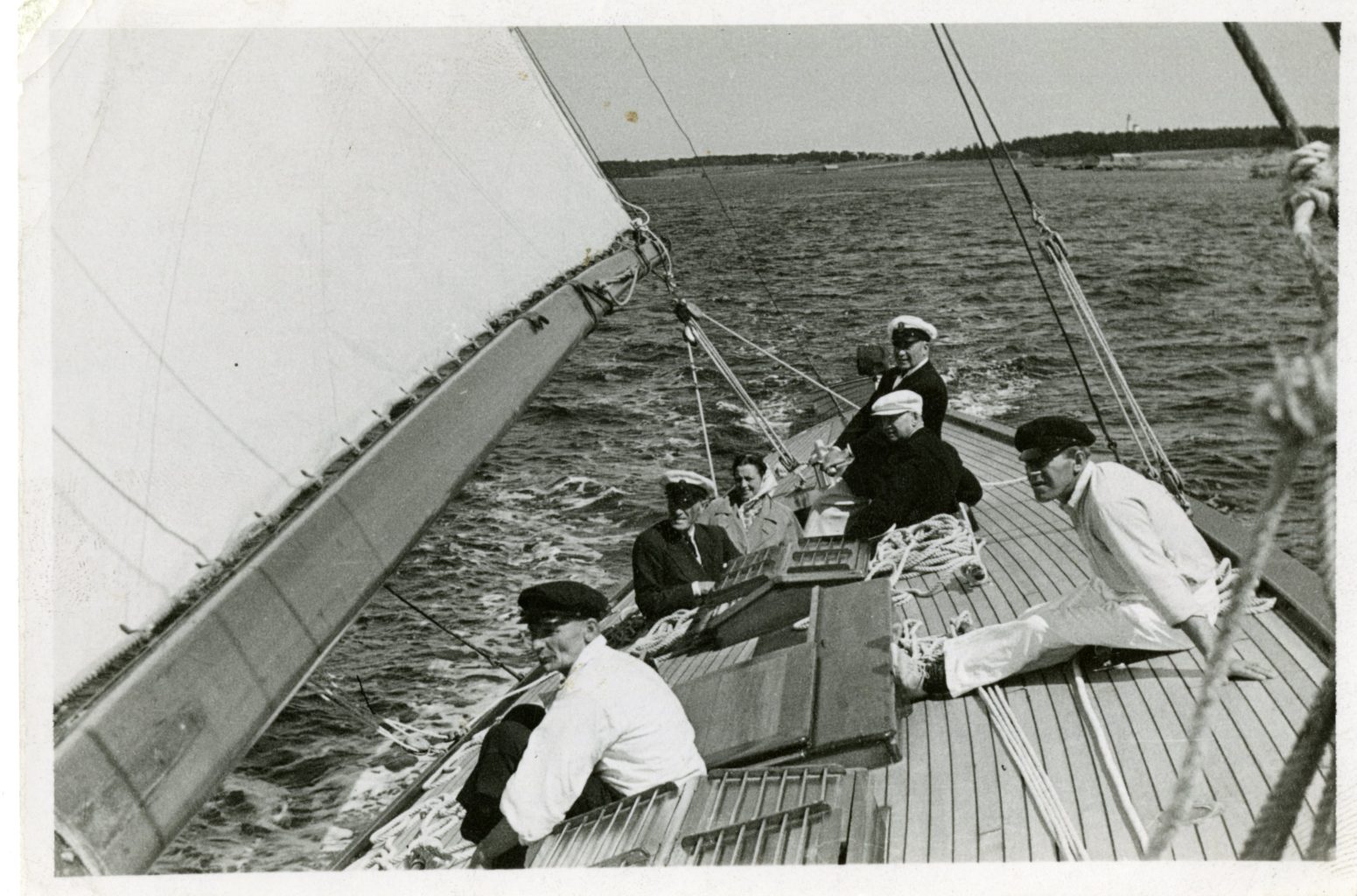 Six people on a sailboat.
