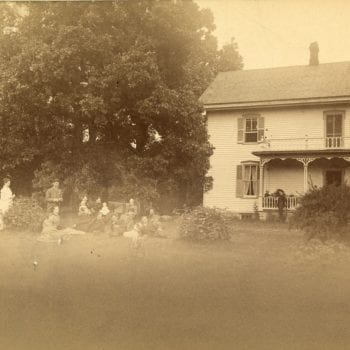 Group of fifteen gather outside the Koren parsonage.