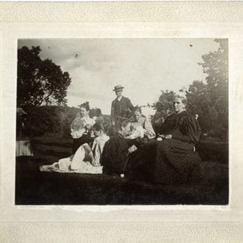 About ten people sit together at the Washington Prairie Parsonage