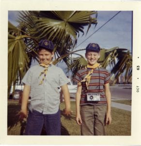 Two boys pose for a silly photo.