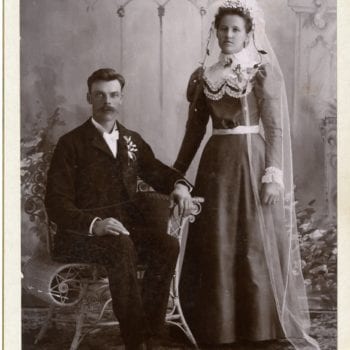 Man and woman pose in a studio.